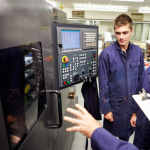 how to get workforce to adopt lean manufacturing, boss with employee at manufacturing system