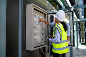 Technician operating Andon system on manufacturing production floor