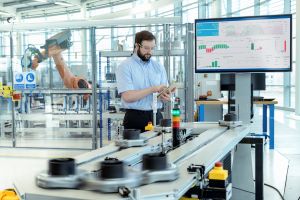 Engineer working on an automated flexible manufacturing system.