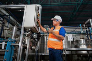 Operator using Andon system in lean manufacturing setup